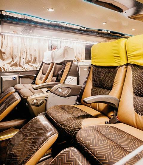 reclining seats on bus with foot rests
